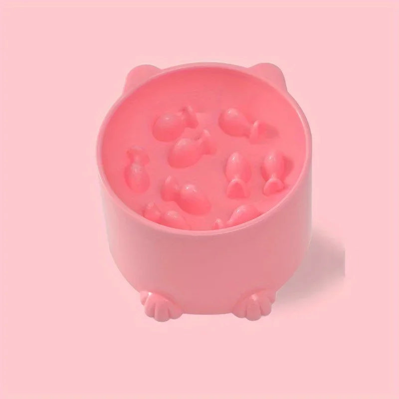 Petite gamelle rose en forme de chat avec oreilles et pattes, poissons en relief au fond — gamelle anti glouton chat