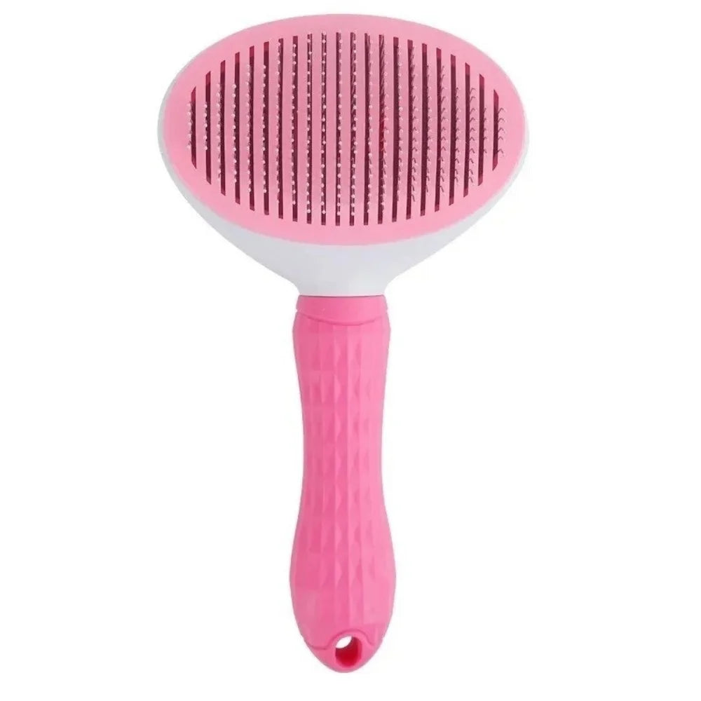 Brosse autonettoyante pour chat coloris rose, tête ovale à picots métalliques et manche caoutchouté
