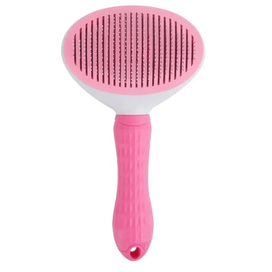 Brosse autonettoyante pour chat coloris rose, tête ovale à picots métalliques et manche caoutchouté