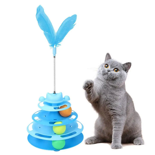 Tour à balles pour chat bleue à quatre niveaux, plume sur ressort, un british shorthair gris levant la patte