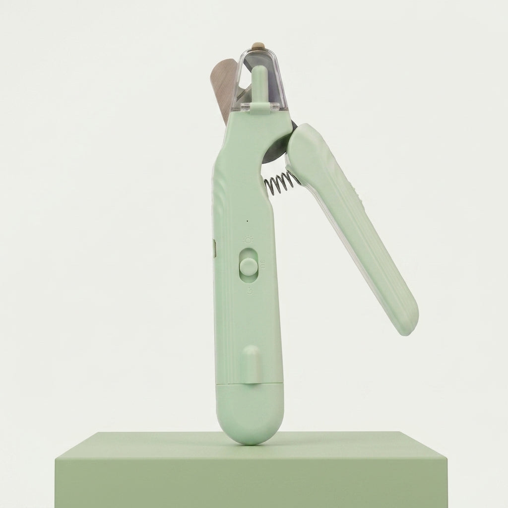 Coupe griffe chat vert amande rechargeable, lame et ressort visibles de profil