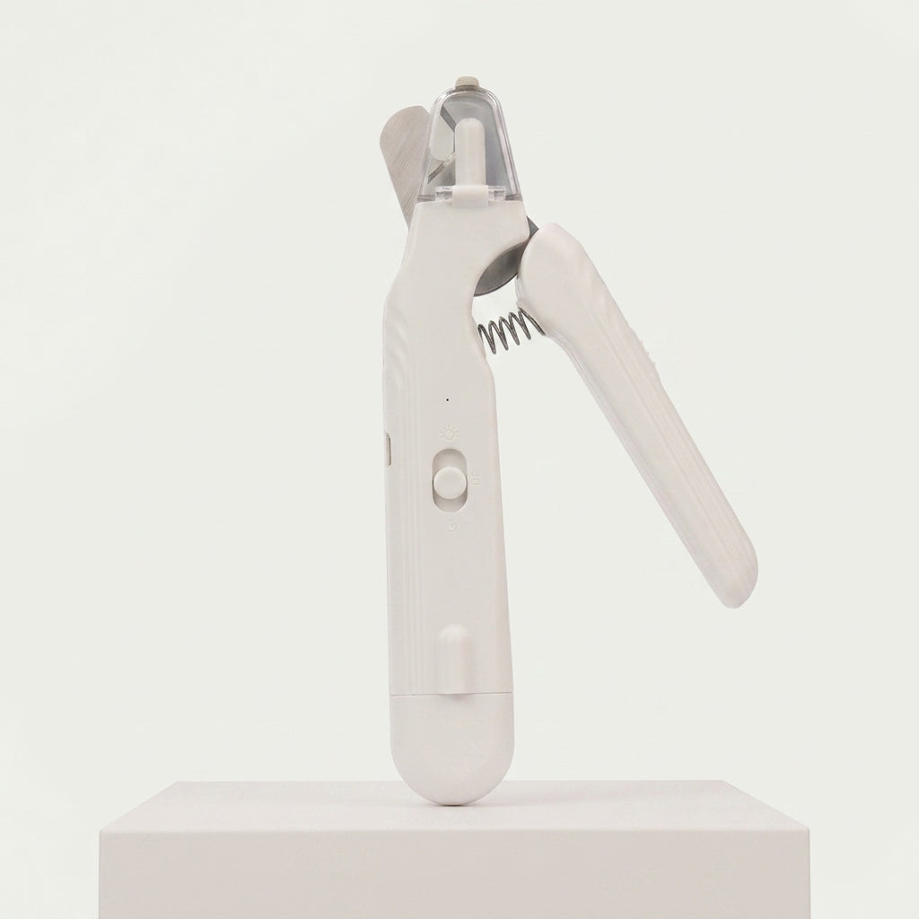 Coupe griffe chat blanc rechargeable, vue de profil sur fond clair